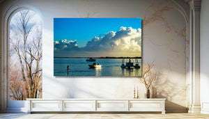 Modern living room with large wall art of boats on water at sunset, luxury interior decor