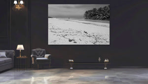 Modern living room with large monochrome beach landscape wall art and elegant furnishings