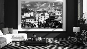 Modern black and white living room with cityscape wall art, geometric rug, and contemporary furniture