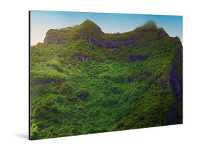 Glossy acrylic photo print featuring a lush green mountain landscape under blue sky