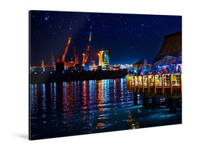 Acrylic photo print of a vibrant night harbor scene with colorful lights and reflections.