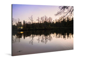 Acrylic photo print of sunset lake scene with tree and city reflections on glossy acrylic.