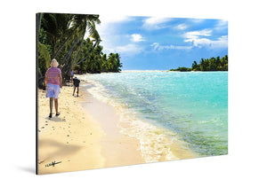 Acrylic photo print showing people walking on a tropical beach with palm trees and turquoise water