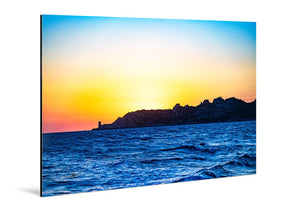 Glossy aluminum Dibond photo print of a vivid seascape with sunset and rugged coastline.