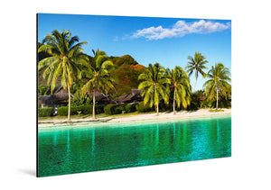 Glossy aluminum photo print of tropical beach with palm trees, clear water, and huts