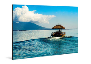 Glossy aluminum photo print featuring a tropical boat on blue water with mountains and clouds