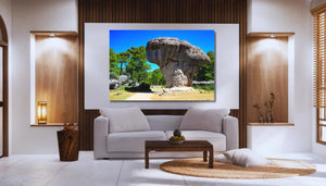 Modern living room with a landscape photo of rock formations and trees on the wall