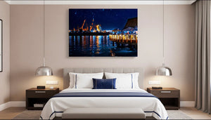 Modern bedroom with a night cityscape wall art above bed, cozy decor and pendant lights